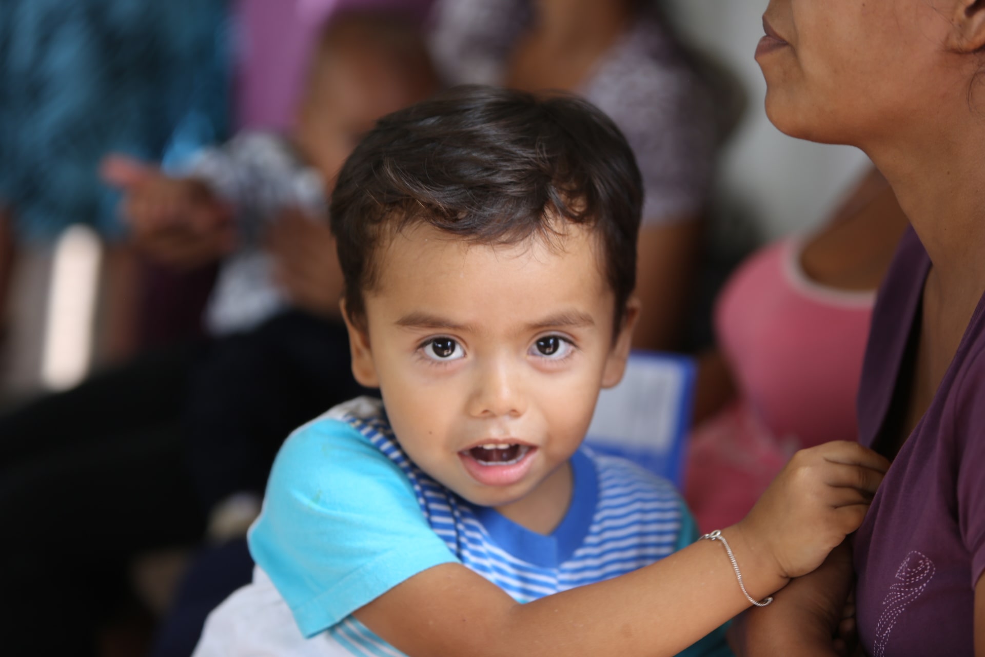 photo of a child looking directly at the camera
