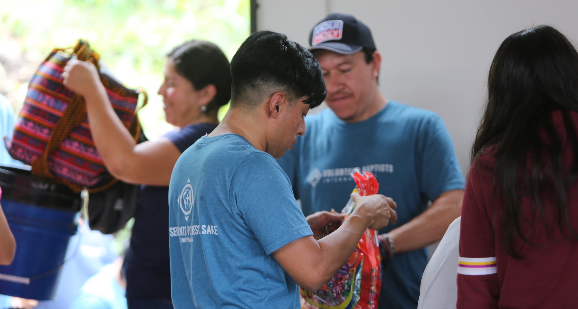 photo of people loading bags